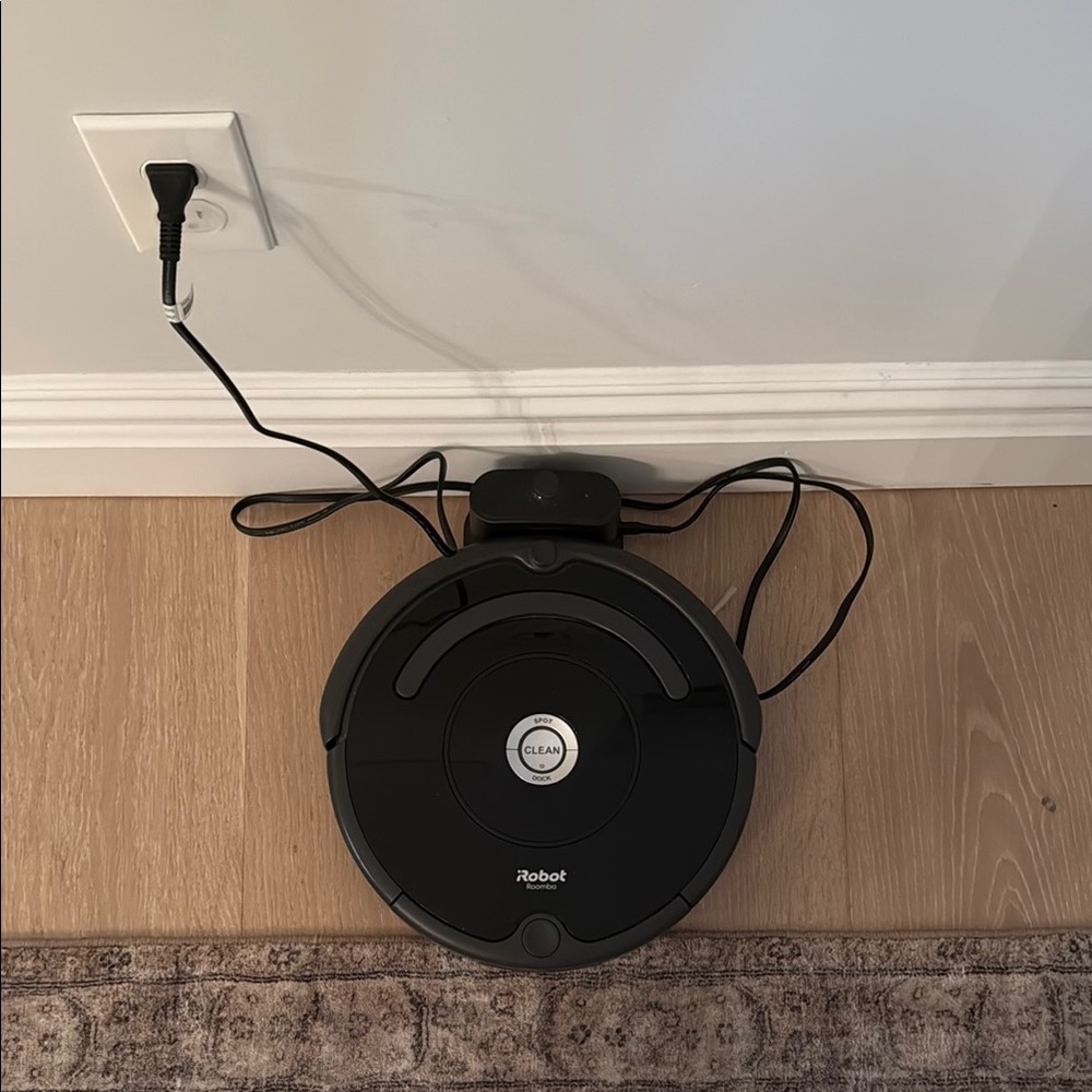 Black Circular Robotic Device with Cord